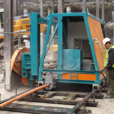 Automated, remotely controlled concrete cutting machine Specially developed for demolition of very thick concrete slab in a difficult worksite. The CS5 increases safety, productivity and blade life.